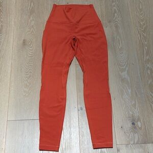 Lululemon Size 6 align High-Waisted Orange Leggings.